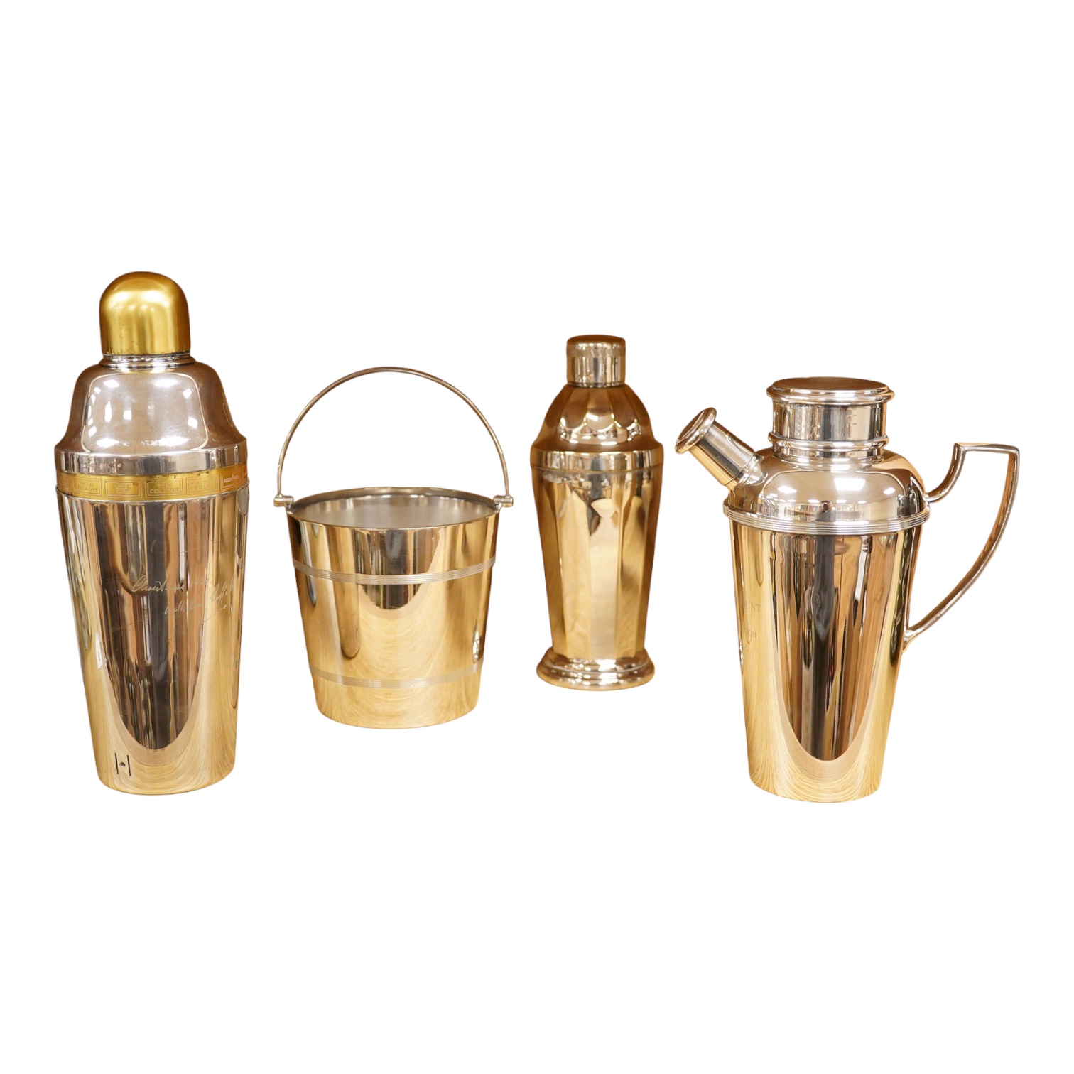 A mid 20th century silver plated patent cocktail shaker with recipes, two other cocktail shakers and an ice bucket, largest 28cm high